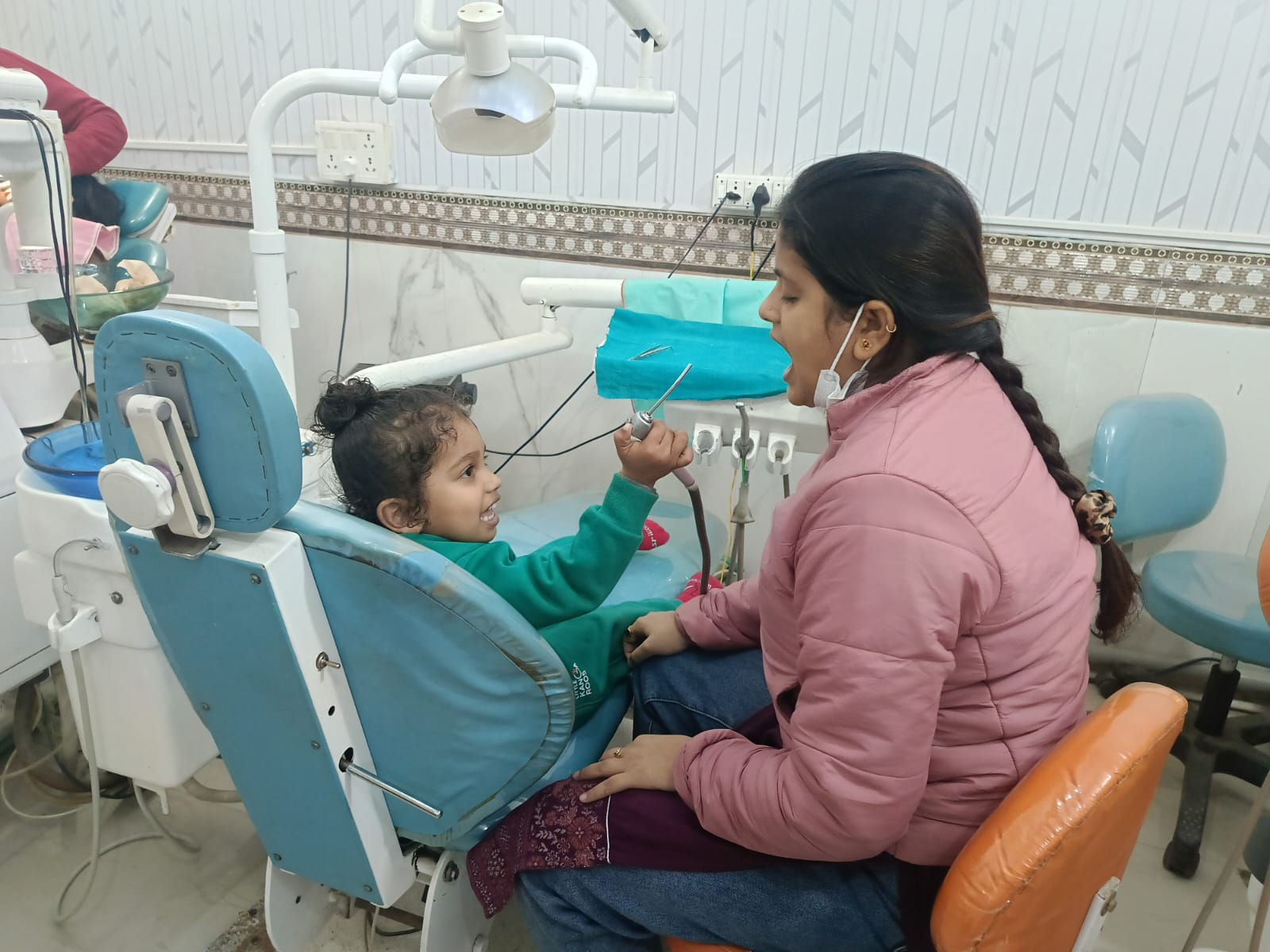 Happy child smiling in a dental chair